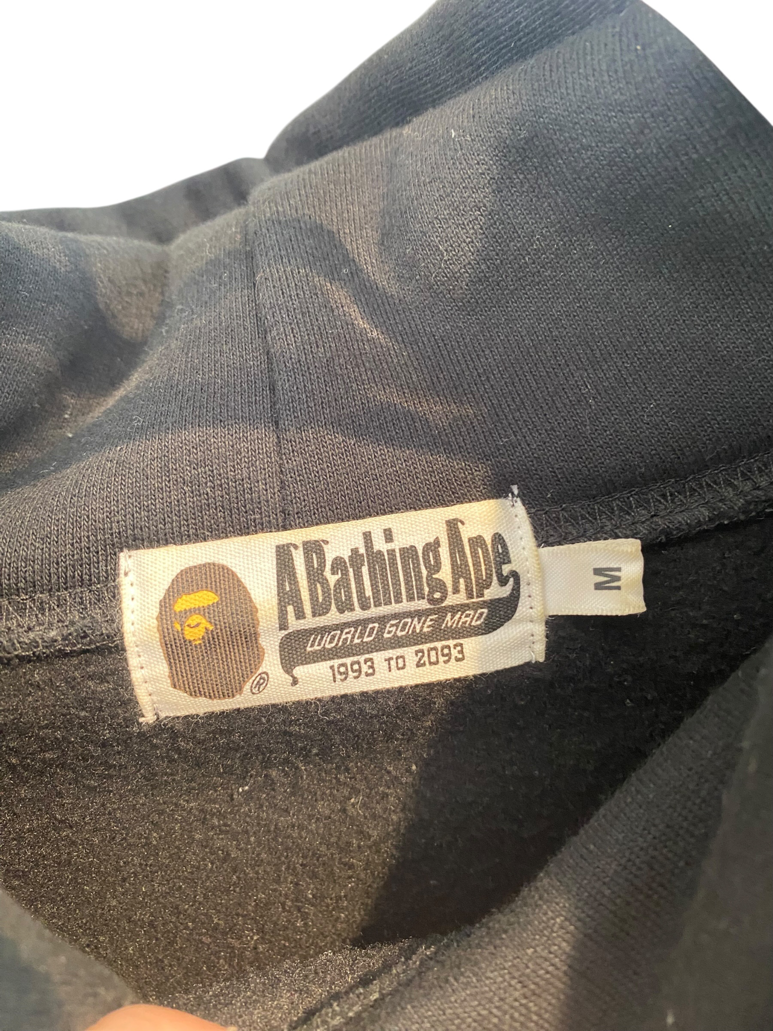 Used BAPE black pullover hoodie sleeve lettering